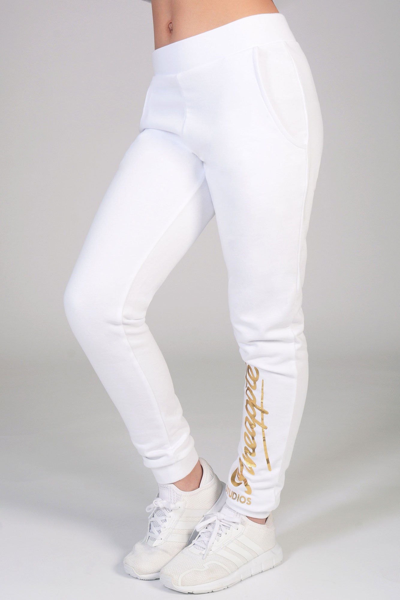Girls' white joggers with gold Pineapple foil logo on the leg