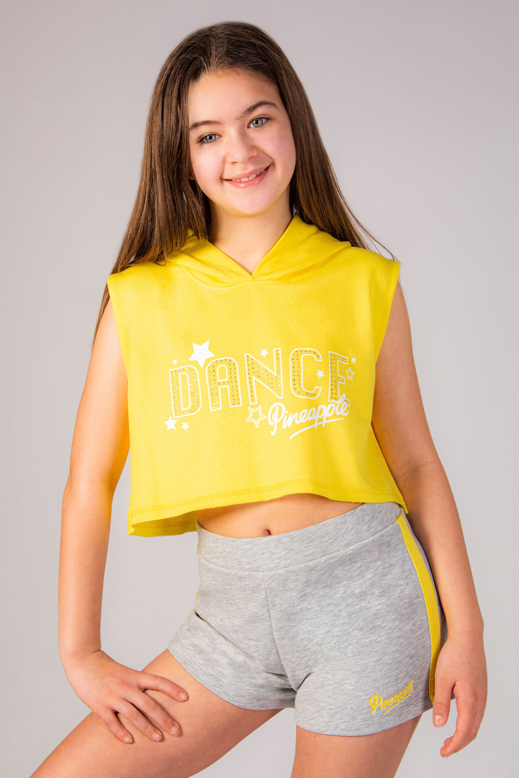 Girls' yellow dance hoodie in sleeveless style with raw edge hem and diamanté chest print.