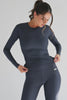 Women's dark grey long sleeve top for the gym made out of stretchy and fitted rib fabric.